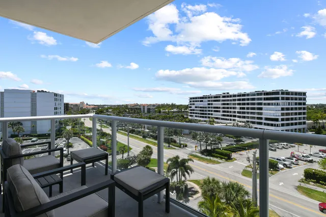 a large white kitchen with a large window