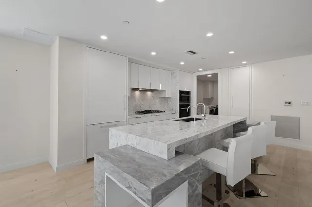 a large kitchen with a large counter top furniture and kitchen view