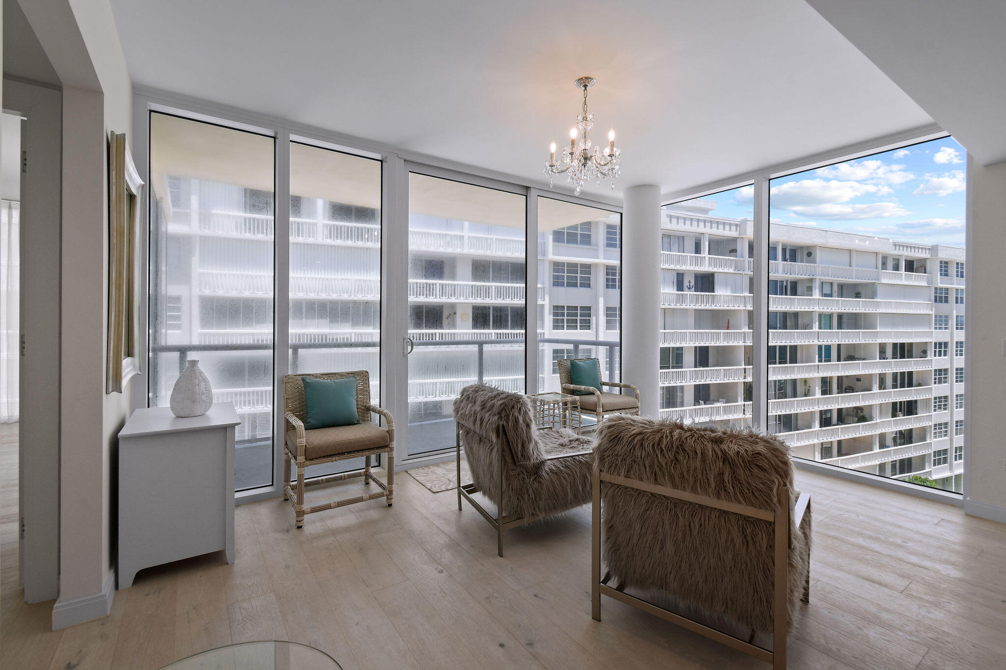 3550 South Ocean Boulevard, Unit 5E South Palm Beach, FL 33480 - Photo 21 of 52 a living room with furniture and a large window