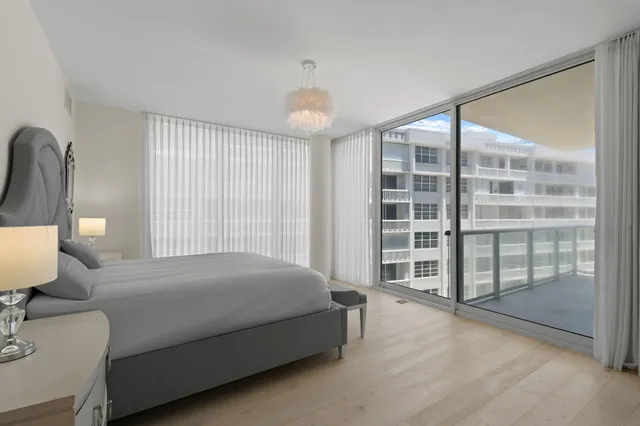 a bathroom with a toilet tub and shower