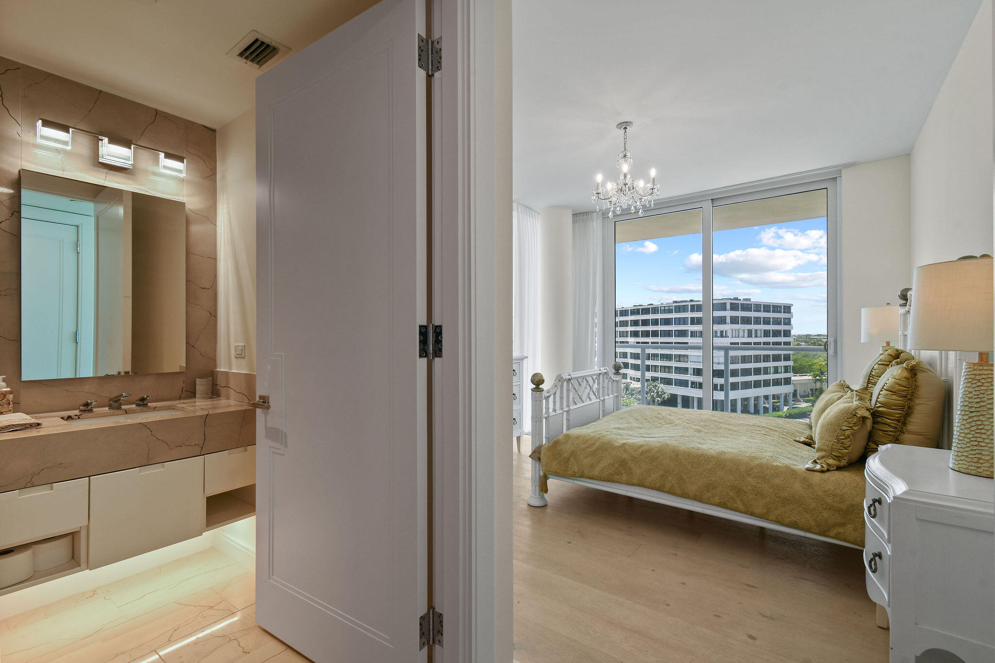 3550 South Ocean Boulevard, Unit 5E South Palm Beach, FL 33480 - Photo 33 of 52 a bedroom with a bed and a mirror