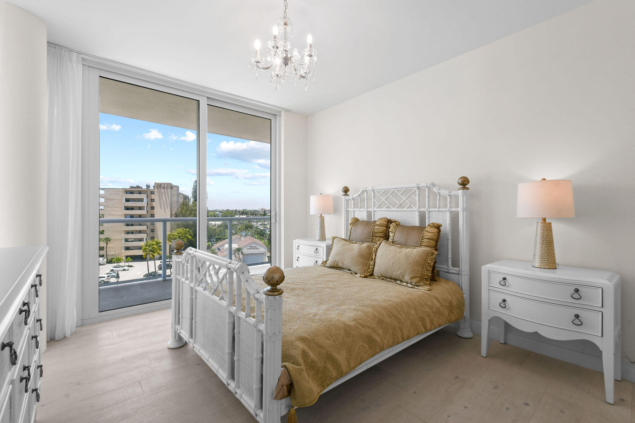 3550 South Ocean Boulevard, Unit 5E South Palm Beach, FL 33480 - Photo 34 of 52 a bedroom with a bed and a large window