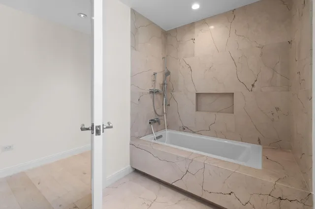 a kitchen with refrigerator and window