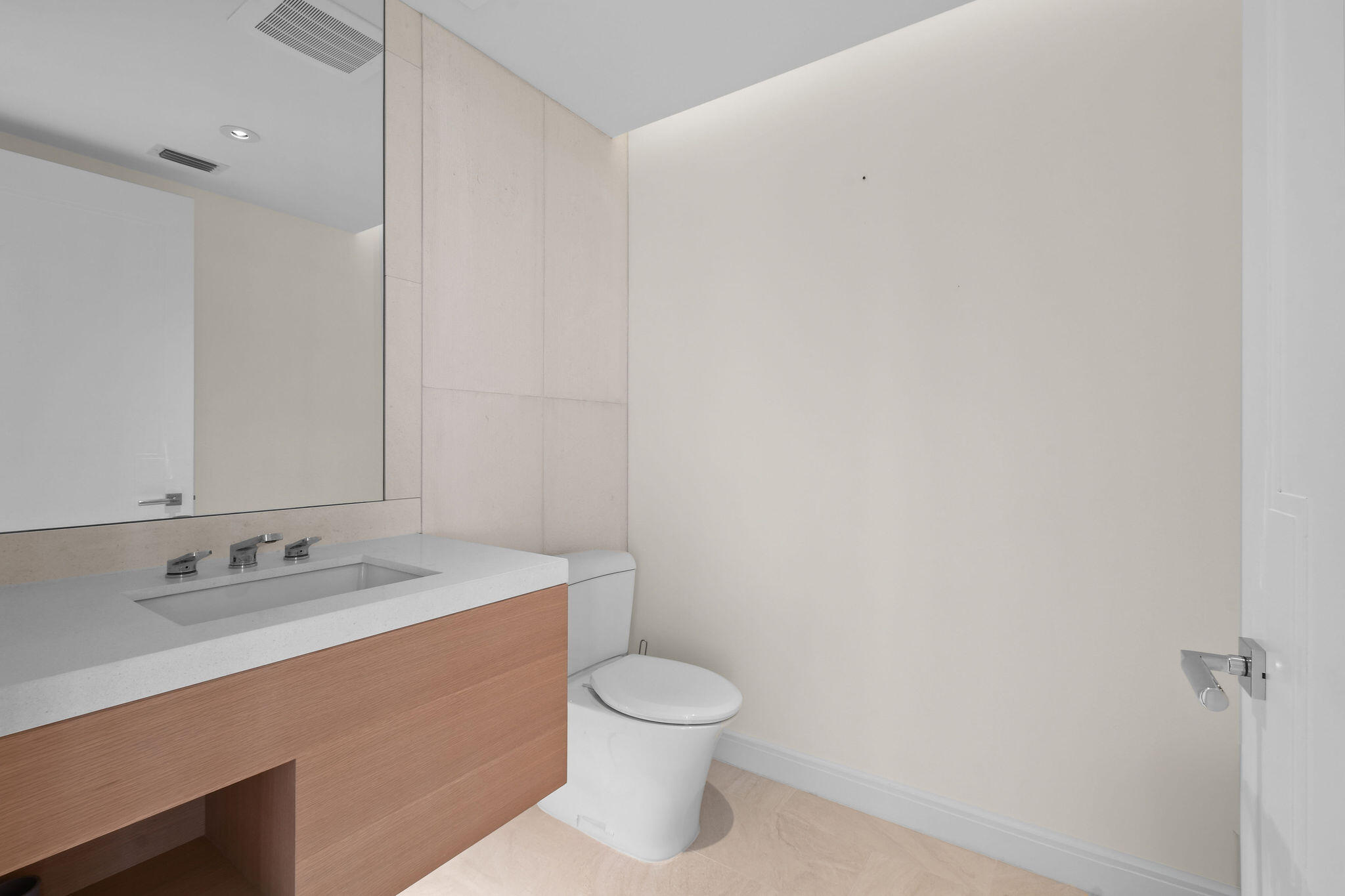 3550 South Ocean Boulevard, Unit 5E South Palm Beach, FL 33480 - Photo 42 of 52 a bathroom with a granite countertop sink a toilet and a mirror