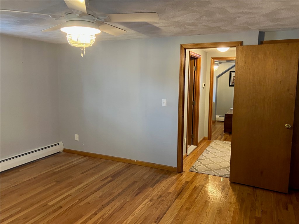 45 Perrin Avenue Pawtucket, RI 02861 - Photo 26 of 33 2nd floor Left Bedroom. Notice the beautiful hardwoods throughout.