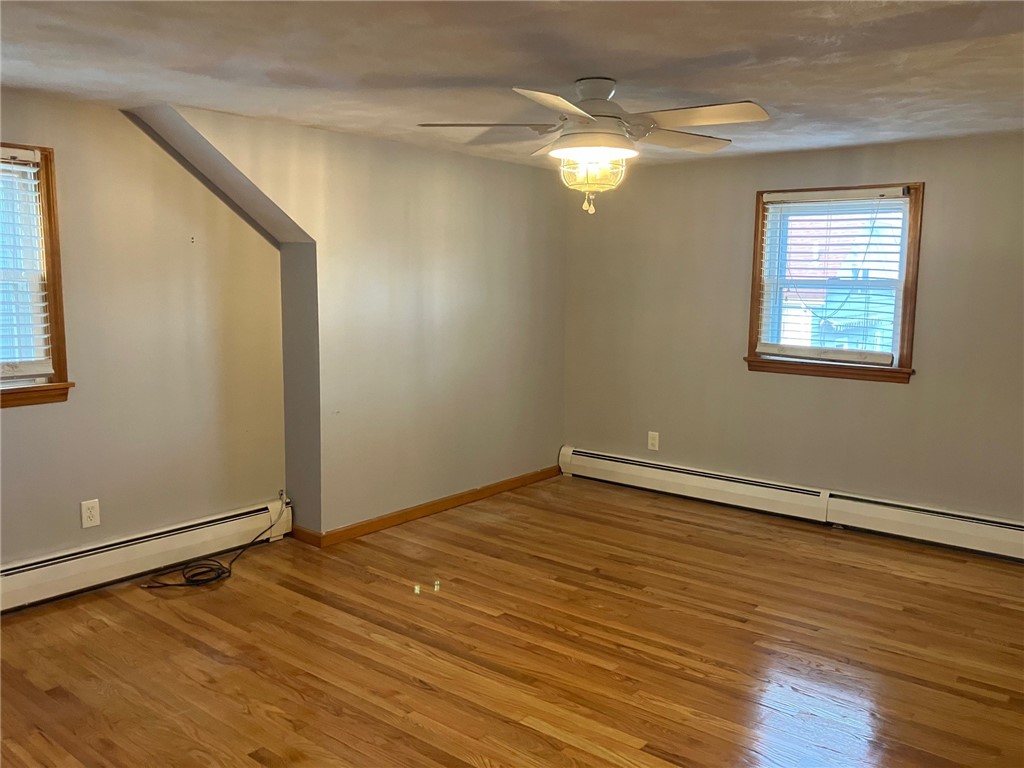 45 Perrin Avenue Pawtucket, RI 02861 - Photo 28 of 33 Spacious and inviting, this is a Large Bedroom, perfect for relaxation and rest.