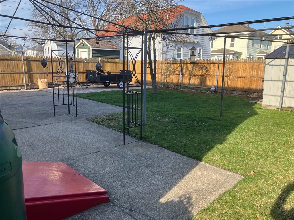 45 Perrin Avenue Pawtucket, RI 02861 - Photo 5 of 33 Fenced back yard. Bulkhead in forefront. (Pavers have been removed.)