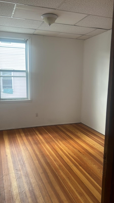 24-28 Hall Street Fall River, MA 02724 - Photo 11 of 13 a view of empty room with wooden floor and fan