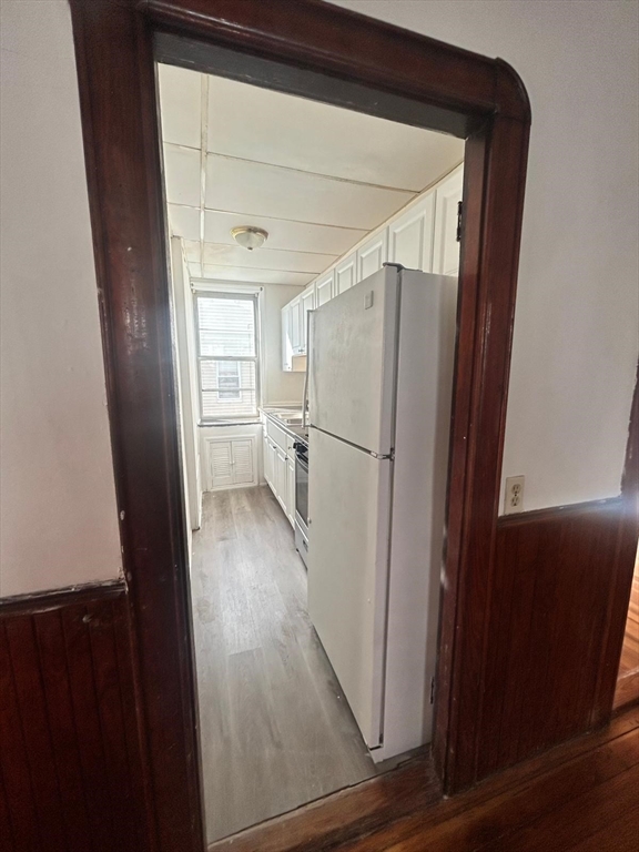 24-28 Hall Street Fall River, MA 02724 - Photo 12 of 13 a view of a living room with a refrigerator