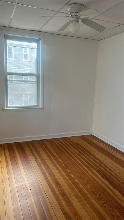 24-28 Hall Street Fall River, MA 02724 - Photo 13 of 13 a view of an empty room with a window and wooden floor
