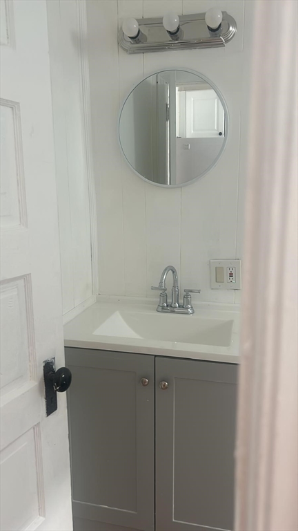 24-28 Hall Street Fall River, MA 02724 - Photo 10 of 13 a bathroom with a sink and mirror