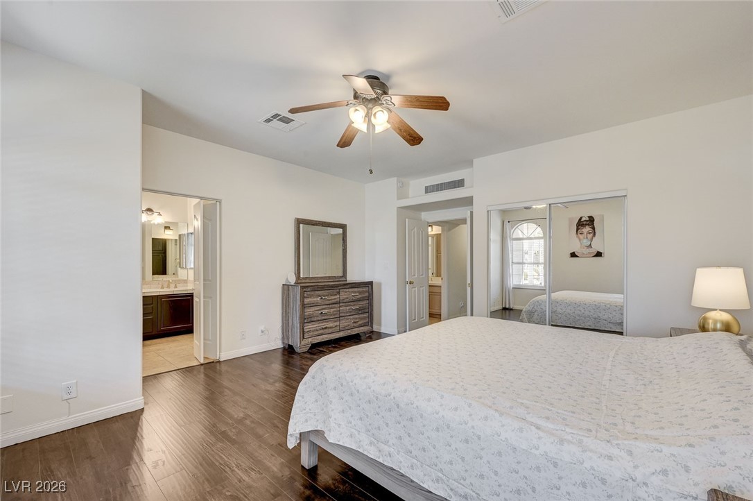 2955 El Camino Road Las Vegas, NV 89146 - Photo 52 of 99 Bedroom with dark wood-style floors, a closet, and ceiling fan