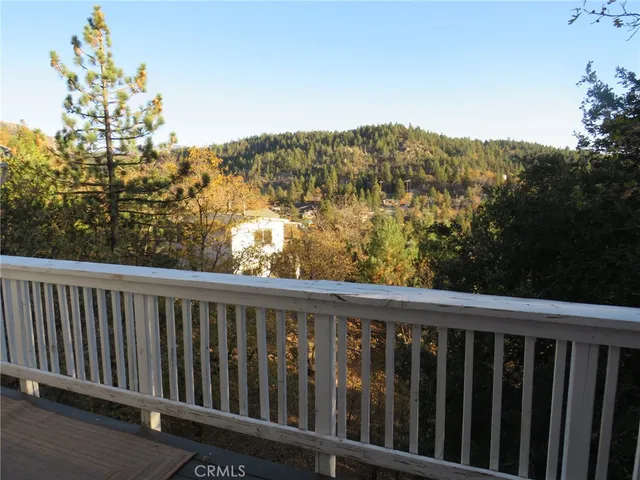 a bedroom with a bed next to a window