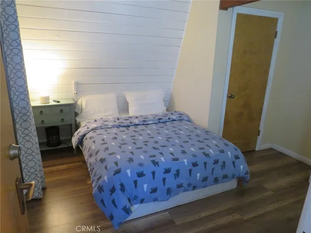 a bathroom with a granite countertop sink mirror vanity and toilet
