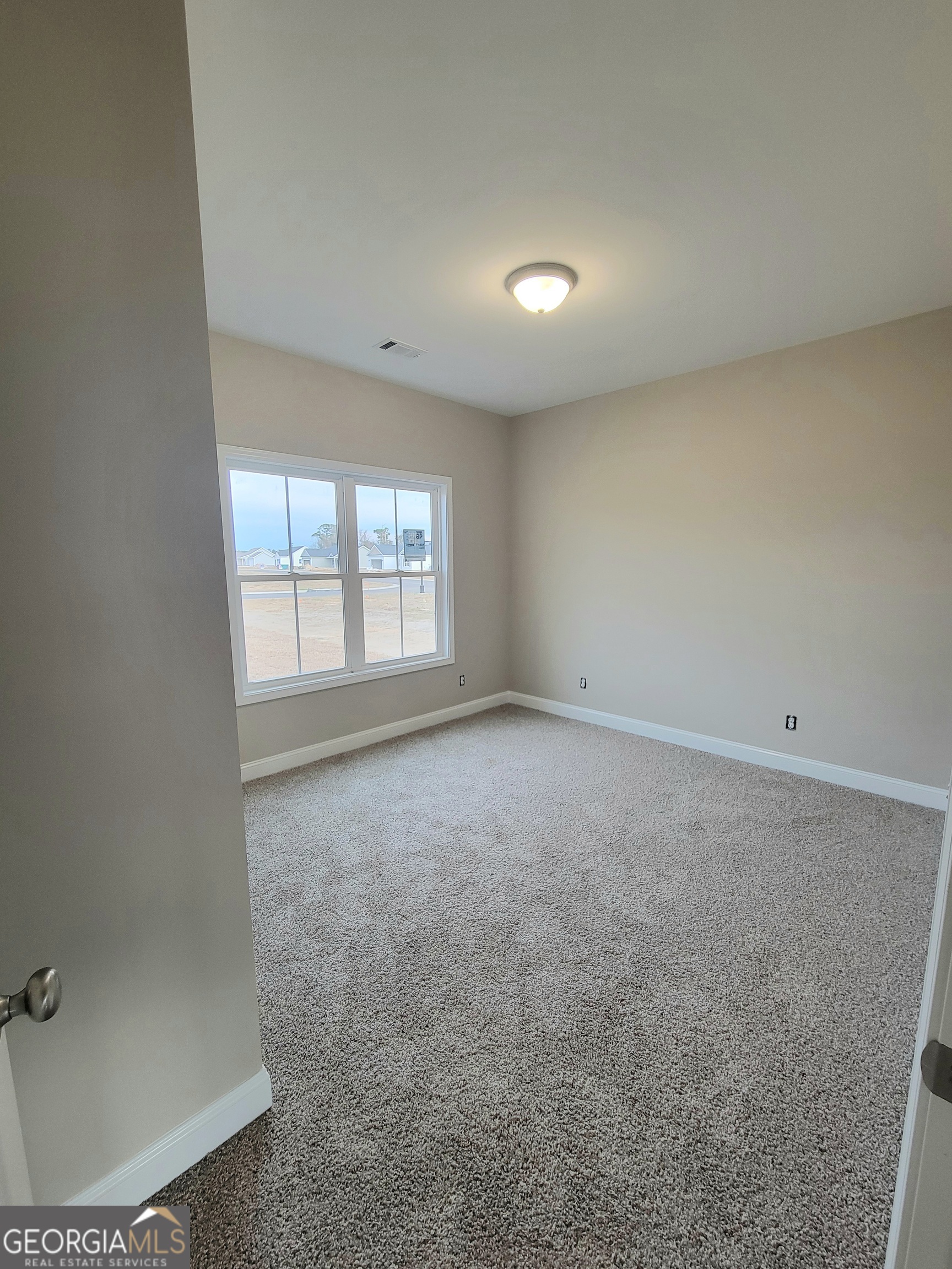 350 Rucker Lane Statesboro, GA 30458 - Photo 12 of 19 an empty room with windows
