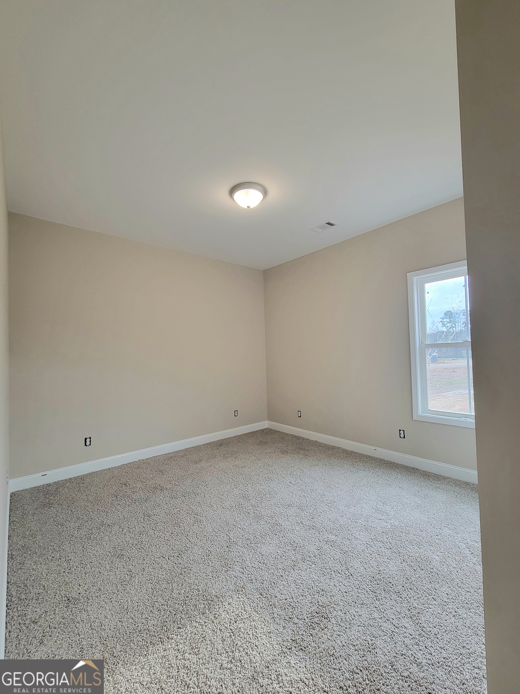350 Rucker Lane Statesboro, GA 30458 - Photo 16 of 19 an empty room with a empty space and window