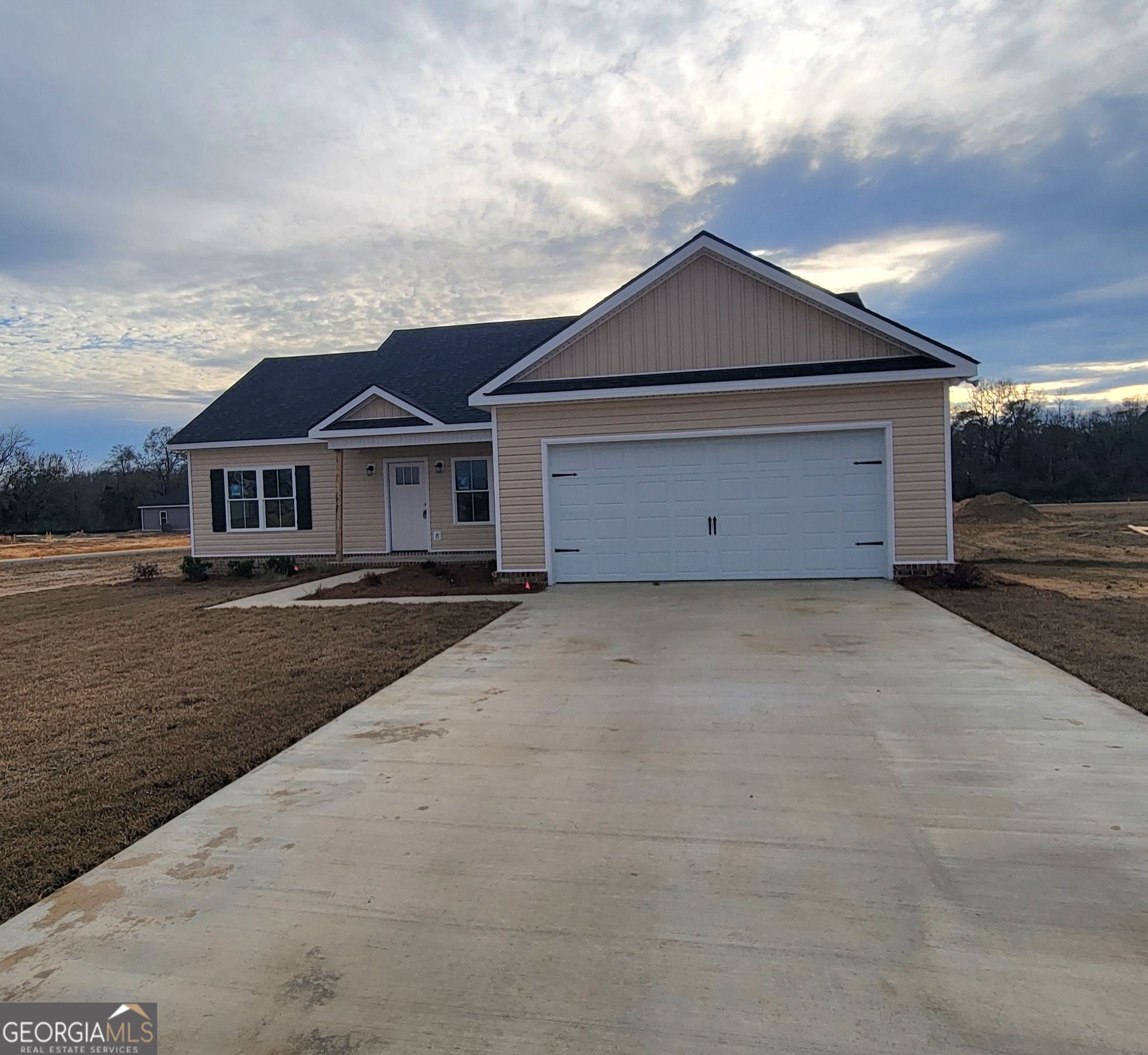 350 Rucker Lane Statesboro, GA 30458 - Photo 2 of 19 a front view of a house with a yard and garage