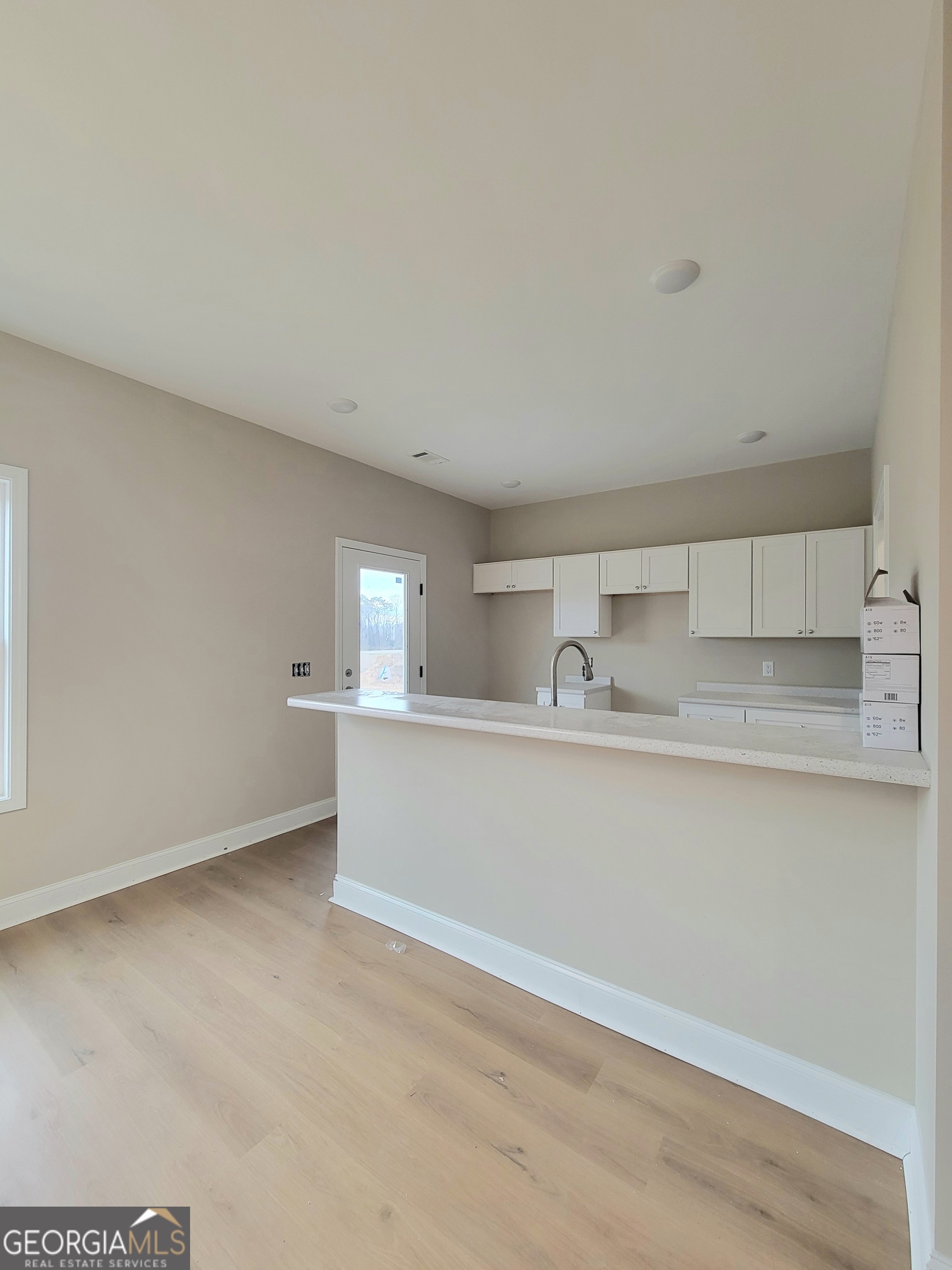 350 Rucker Lane Statesboro, GA 30458 - Photo 5 of 19 a kitchen with a sink cabinets and a window