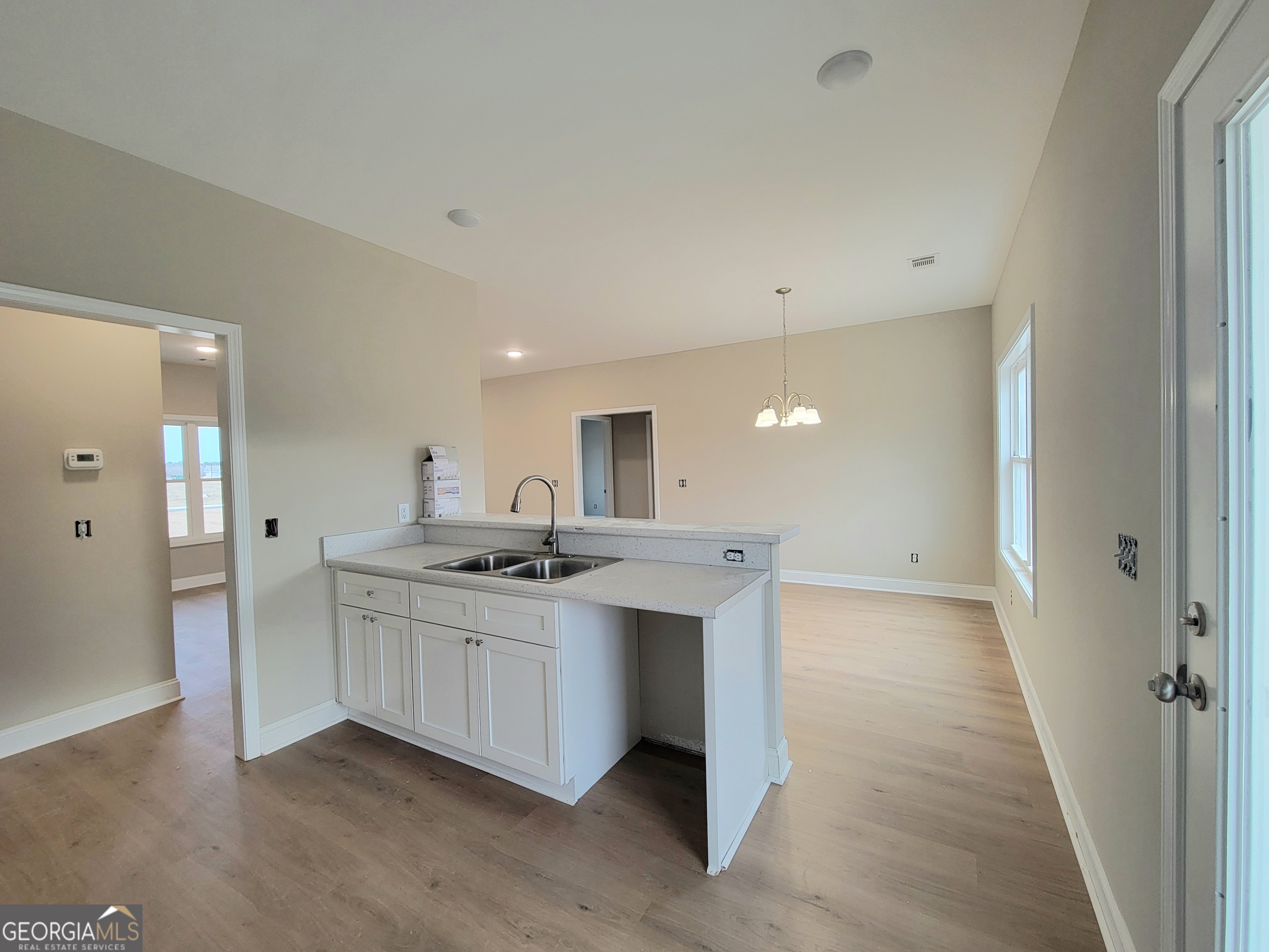 350 Rucker Lane Statesboro, GA 30458 - Photo 6 of 19 a kitchen with stainless steel appliances a sink and cabinets