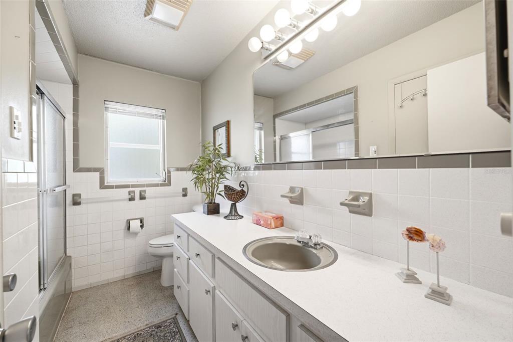 1830 South Mandarin Terrace Inverness, FL 34450 - Photo 17 of 47 a bathroom with a sink a toilet and mirror