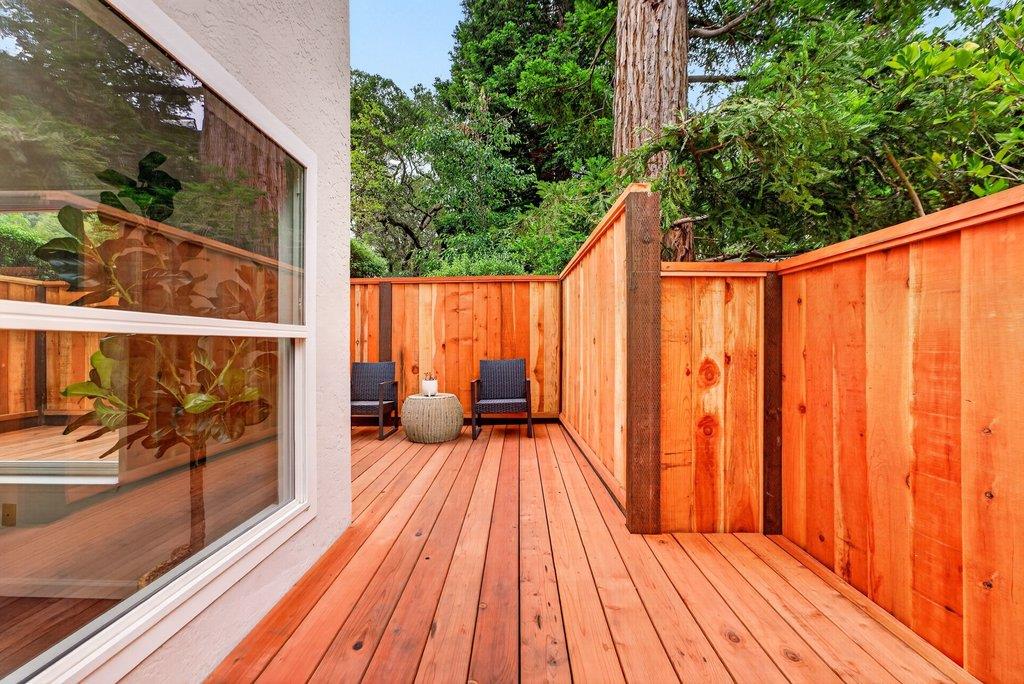 203 Bean Creek Road, Unit K Scotts Valley, CA 95066 - Photo 32 of 43 a balcony with wooden floor table and chairs