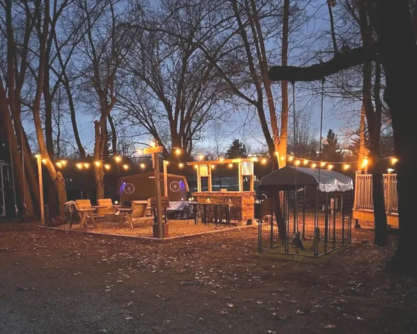 a backyard of a house with outdoor seating