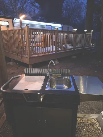 a view of a porch with a table and chairs