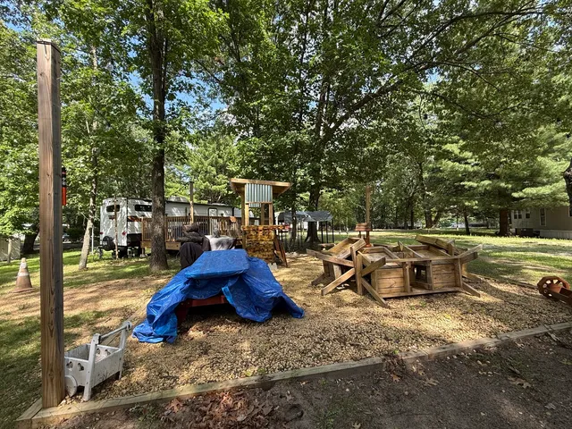 a backyard of a house with barbeque oven