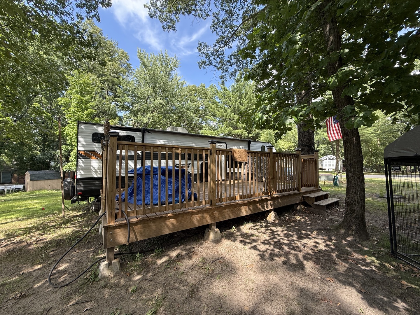 5-464 Woodhaven Lakes Sublette, IL 61367 - Photo 4 of 48 a view of a small backyard with large trees and wooden fence