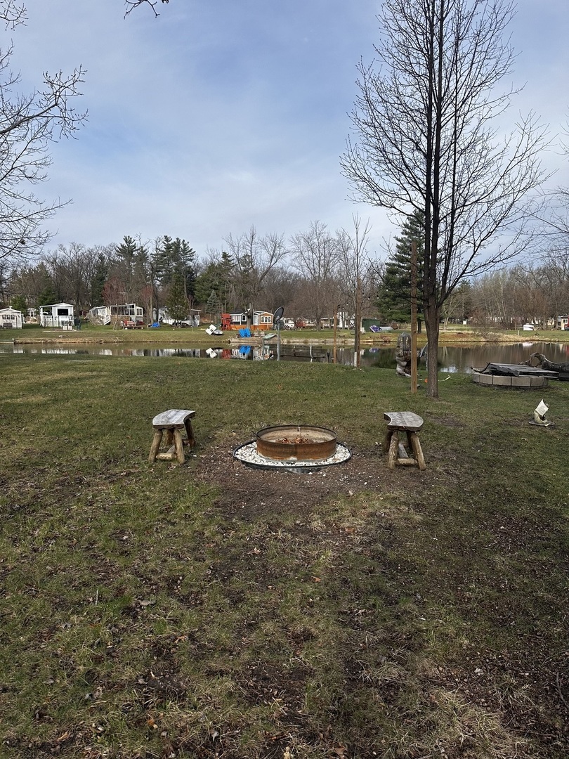 5-464 Woodhaven Lakes Sublette, IL 61367 - Photo 41 of 48 a view of a lake in middle of forest