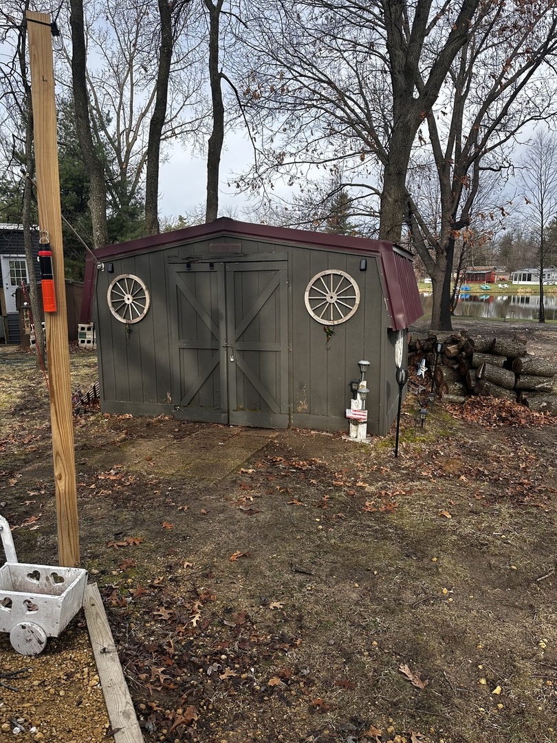 5-464 Woodhaven Lakes Sublette, IL 61367 - Photo 42 of 48 a view of a outdoor space with trees