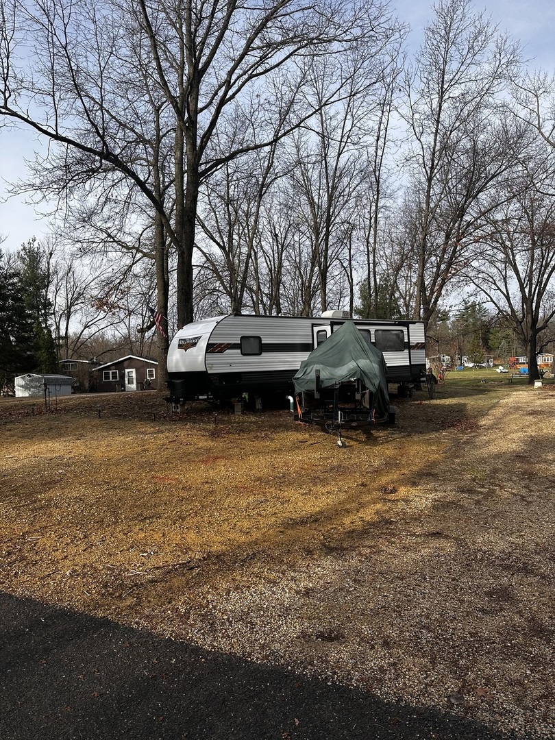5-464 Woodhaven Lakes Sublette, IL 61367 - Photo 43 of 48 a view of a lake with houses