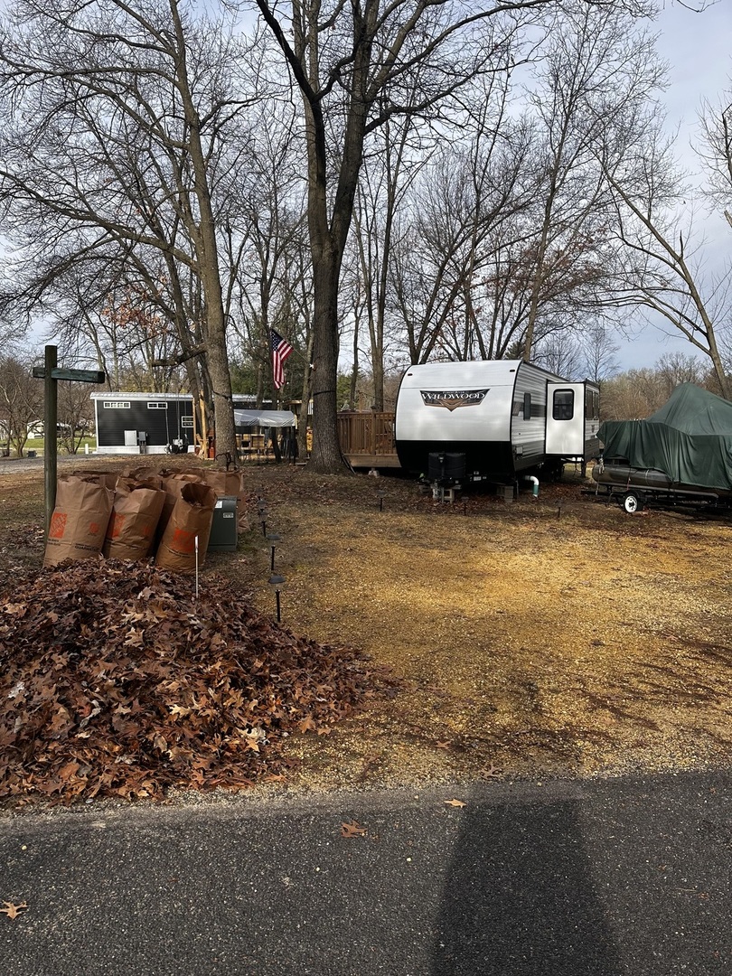 5-464 Woodhaven Lakes Sublette, IL 61367 - Photo 44 of 48 a view of a house with a yard