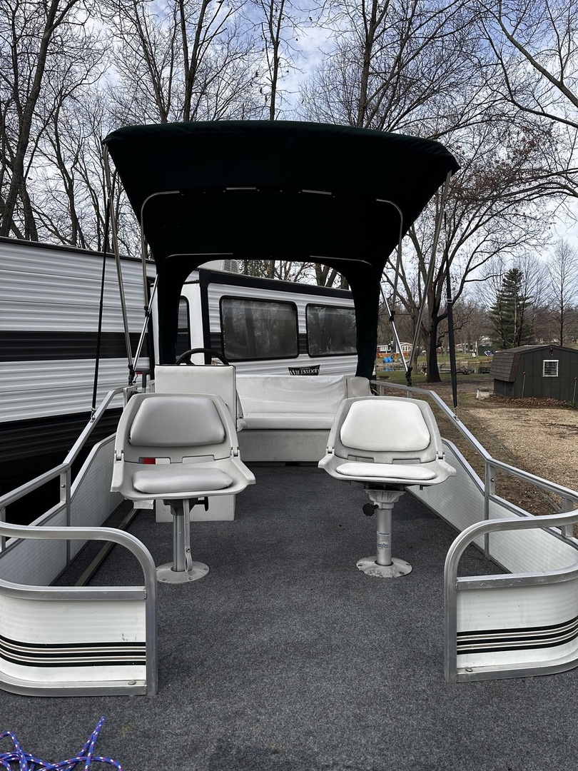 5-464 Woodhaven Lakes Sublette, IL 61367 - Photo 46 of 48 a view of a patio with a table chairs and a barbeque
