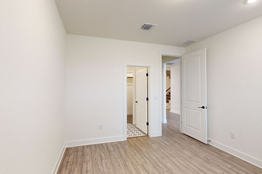 3825 Waxahachie Road Leander, TX 78641 - Photo 12 of 40 a view of an empty room and wooden floor