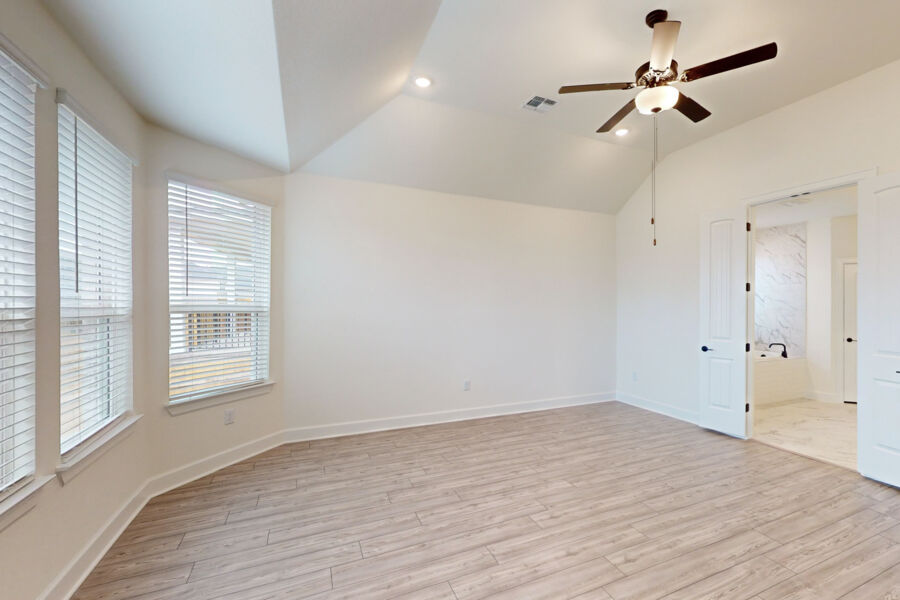 3825 Waxahachie Road Leander, TX 78641 - Photo 17 of 40 a view of empty room with wooden floor and fan