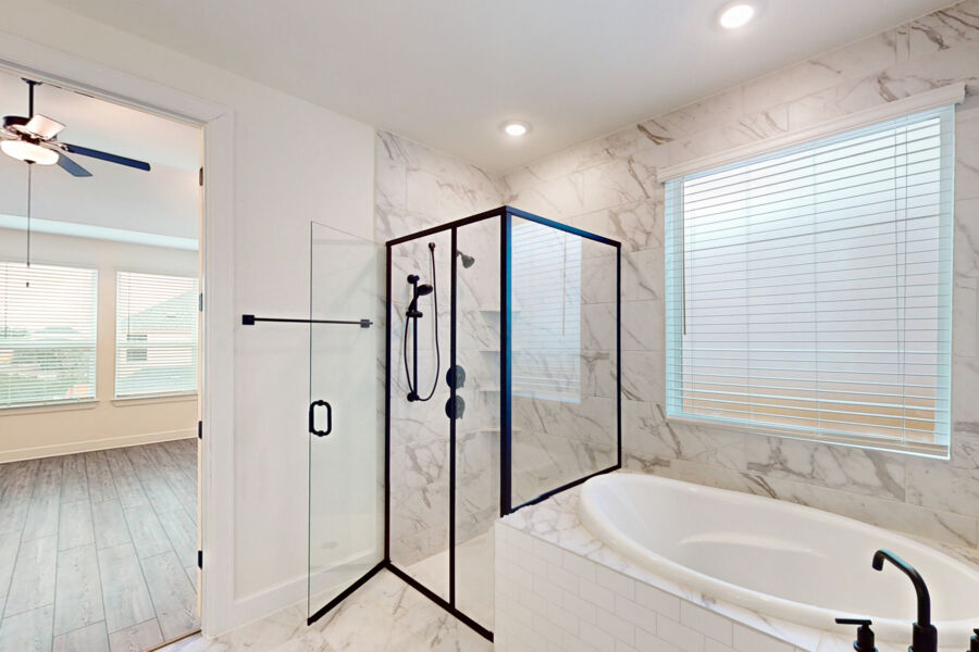 3825 Waxahachie Road Leander, TX 78641 - Photo 19 of 40 a bathroom with a bathtub and a shower