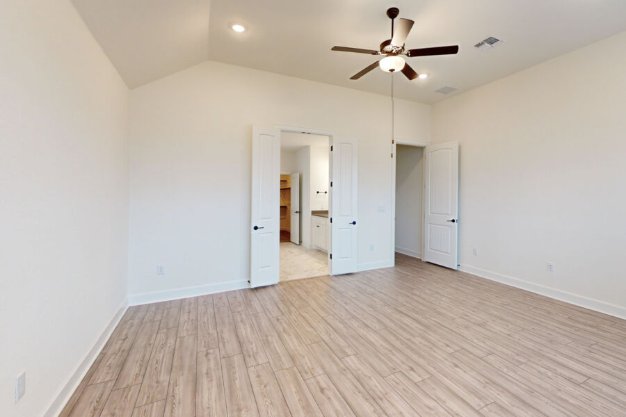 3825 Waxahachie Road Leander, TX 78641 - Photo 20 of 40 a view of empty room with wooden floor and fan