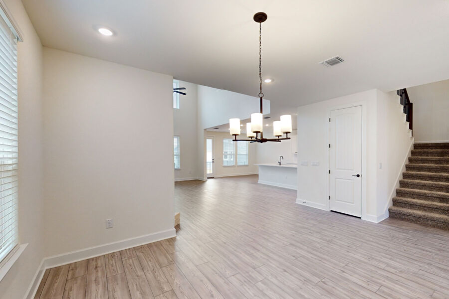 3825 Waxahachie Road Leander, TX 78641 - Photo 3 of 40 a view of a room with wooden floor and staircase