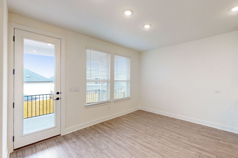 3825 Waxahachie Road Leander, TX 78641 - Photo 36 of 40 an empty room with wooden floor and windows