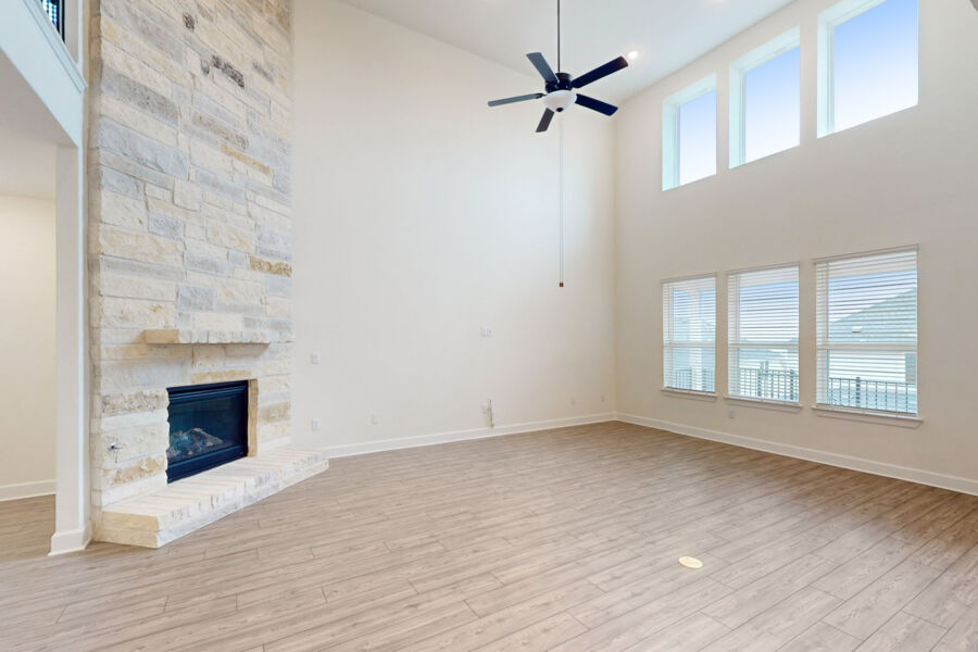 3825 Waxahachie Road Leander, TX 78641 - Photo 5 of 40 wooden floor fireplace and windows in an empty room