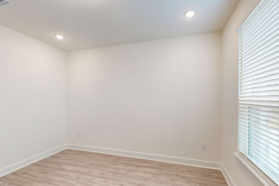 3825 Waxahachie Road Leander, TX 78641 - Photo 7 of 40 a view of an empty room with wooden floor and a window