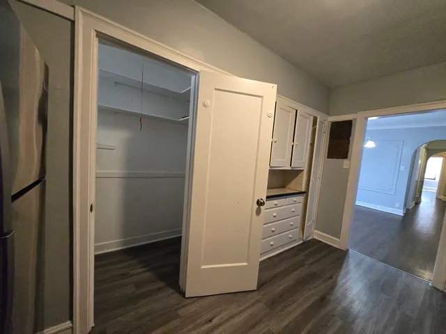 a view of a refrigerator in kitchen and wooden floor