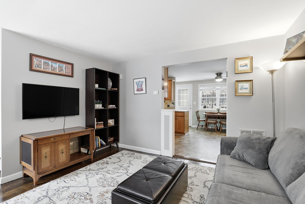 86 Durham Road, Unit 86 Dedham, MA 02026 - Photo 6 of 26 a living room with furniture and a flat screen tv