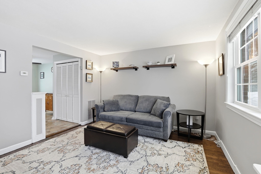86 Durham Road, Unit 86 Dedham, MA 02026 - Photo 7 of 26 a living room with furniture and a rug
