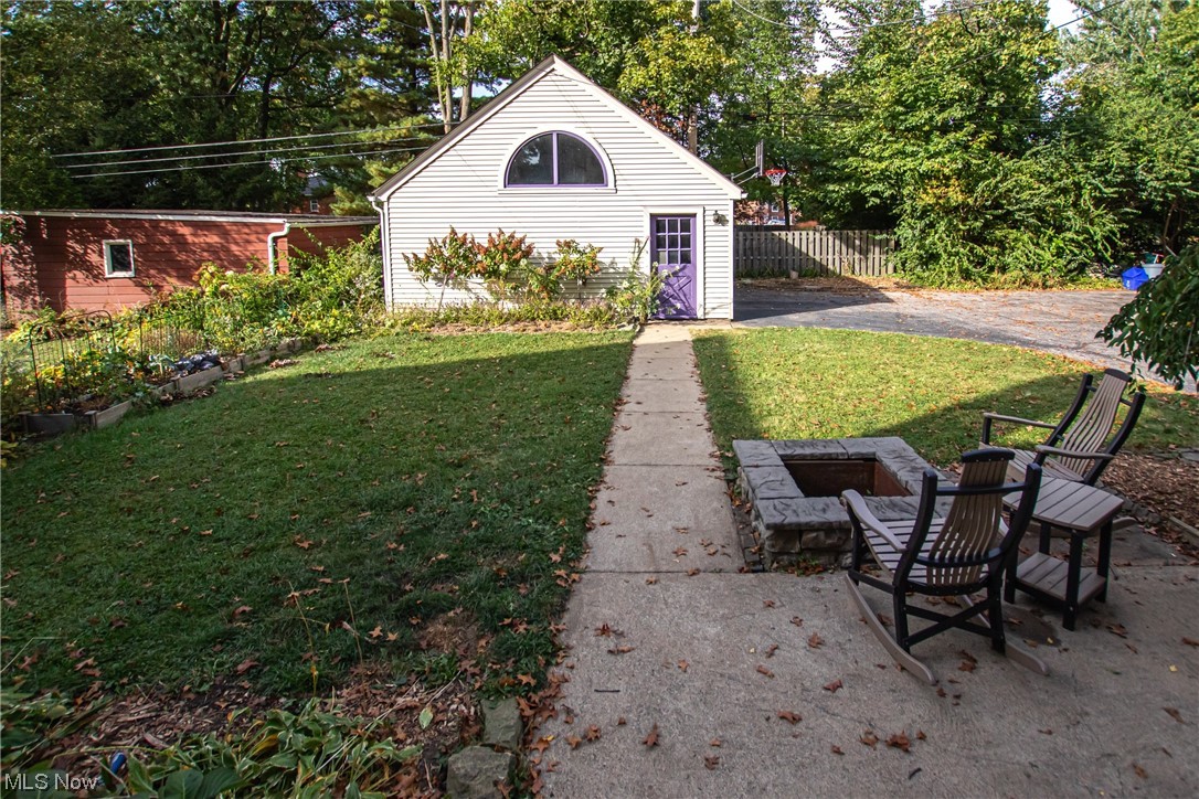 15911 Fernway Road Cleveland, OH 44120 - Photo 27 of 32 View of yard, fire pit, patio chairs and garage