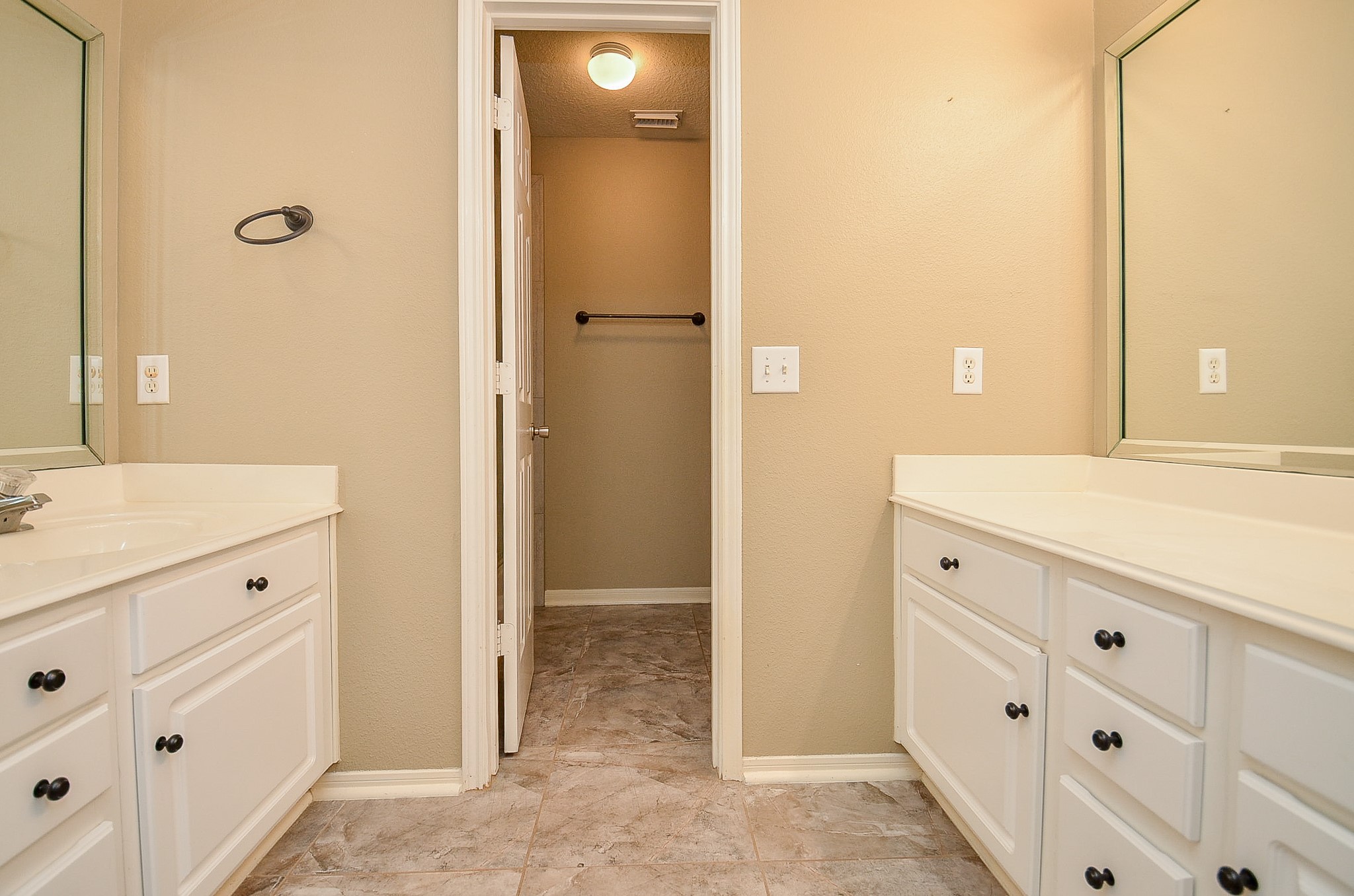 1222 Ragsdale Lane Katy, TX 77494 - Photo 25 of 31 Secondary bathroom upstairs has two vanities. Good storage, pretty tile flooring and a privacy door to the tub/toilet area.