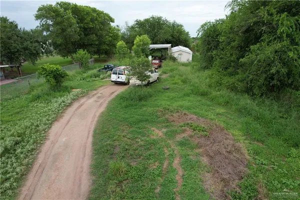 a aerial view of a house with a yard and garden