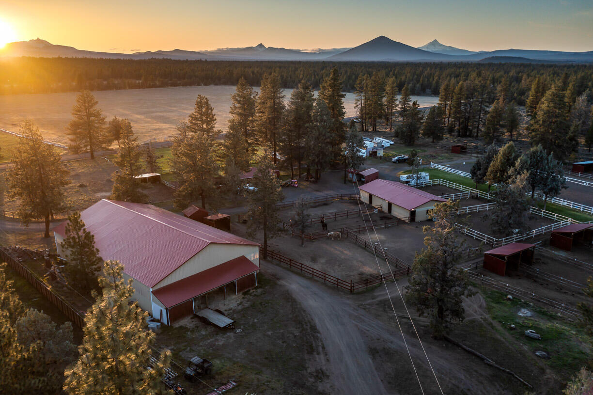 67500 Harrington Loop Road Bend, OR 97703 - Photo 58 of 72 a view of a house with a yard and mountain view
