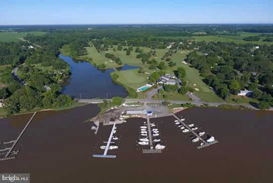 an aerial view of a house with yard